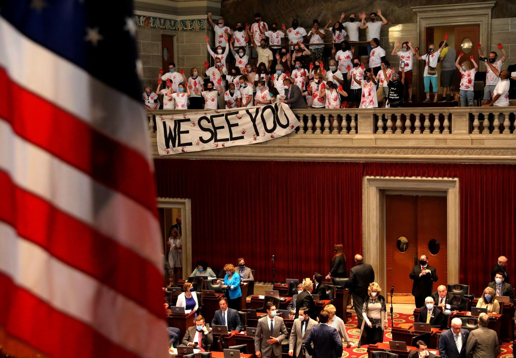 ExpectUsSTL protesters drop poster during House debate